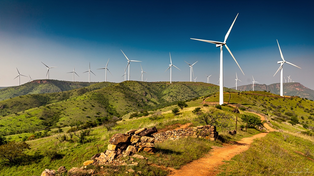 Kappatagudda hills with white windmills against blue sky